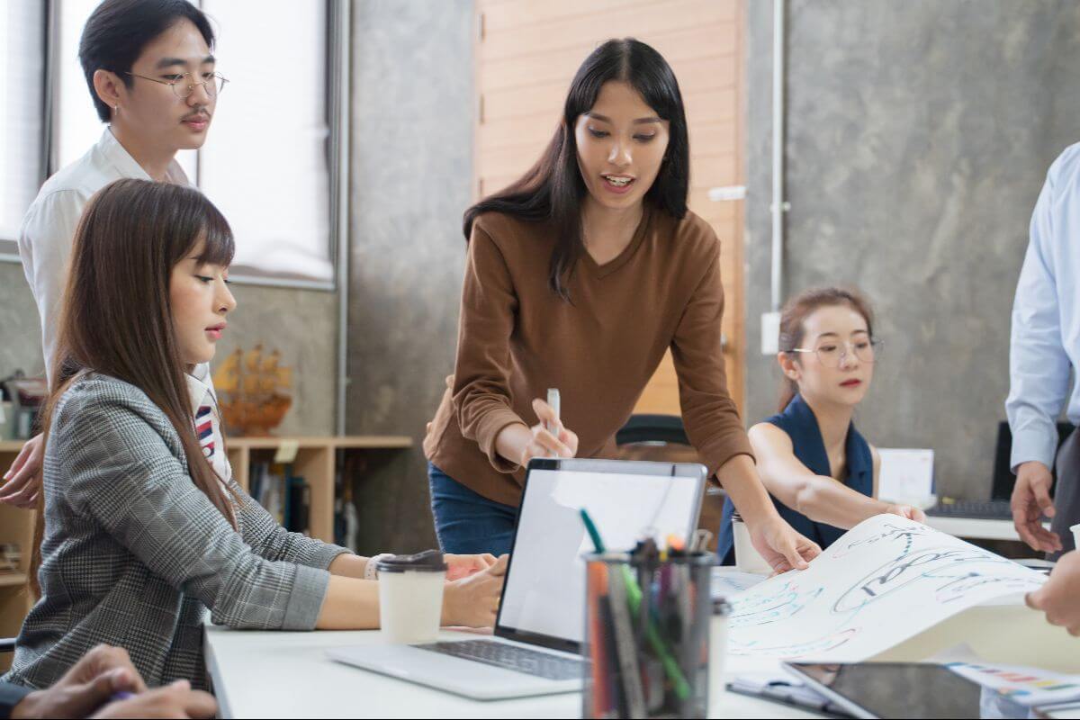 team leaders in a room prioritizing well-being and purpose