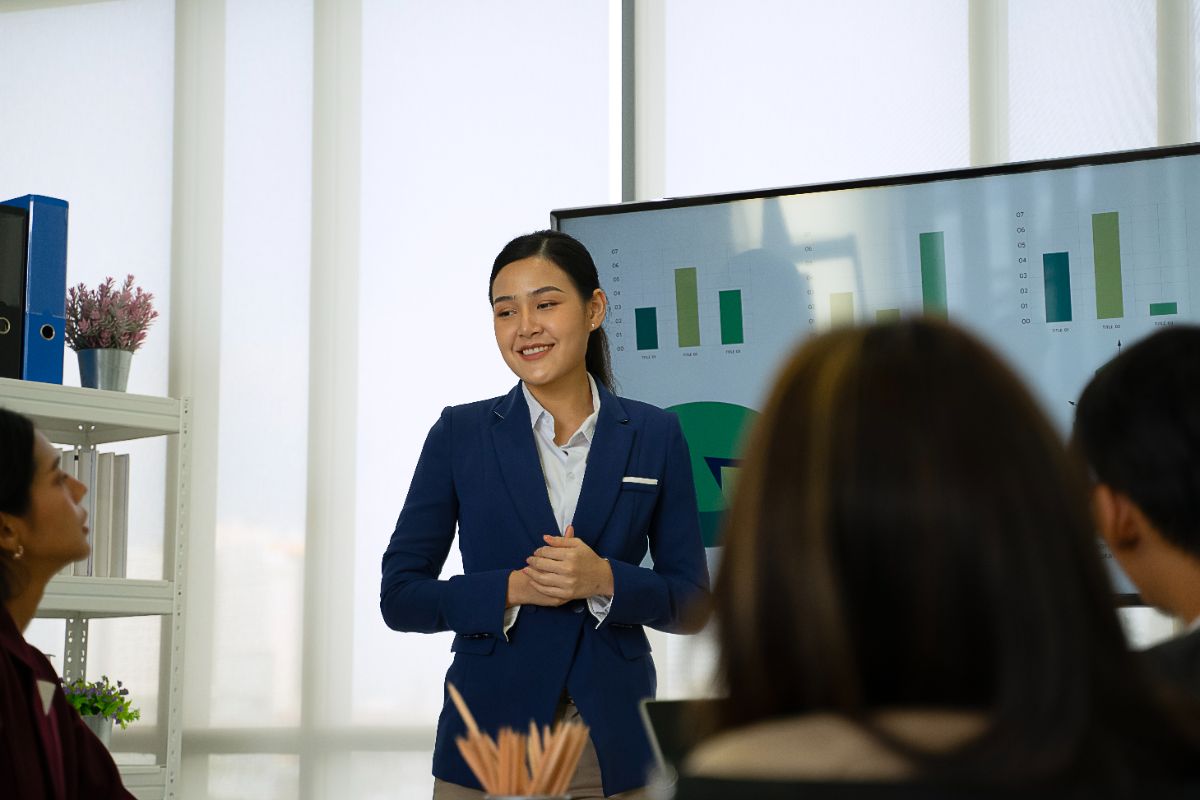 Business leader presenting market data to guide C-level hiring strategy decisions