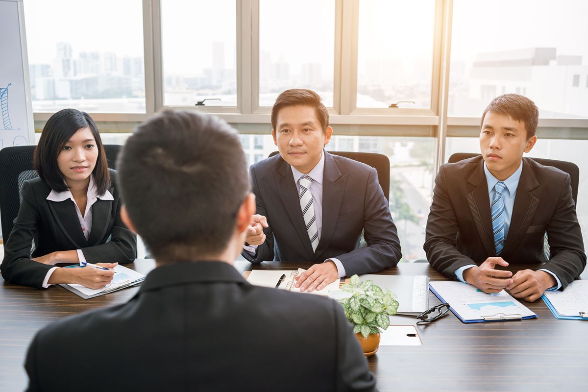 Hiring panel interviewing executive candidates during a structured leadership recruitment process