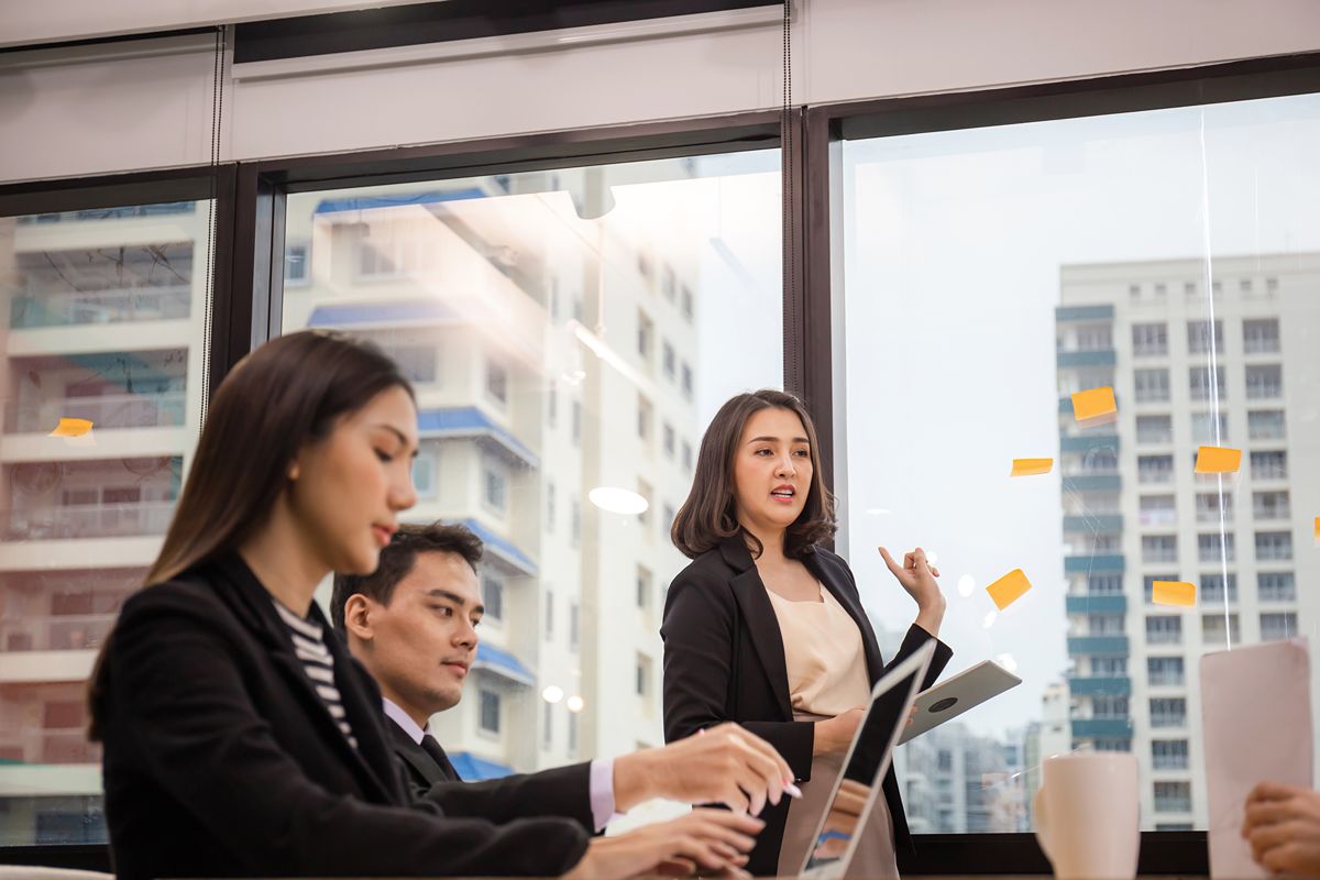 Business team discussing C-level hiring strategy during a meeting in a modern office