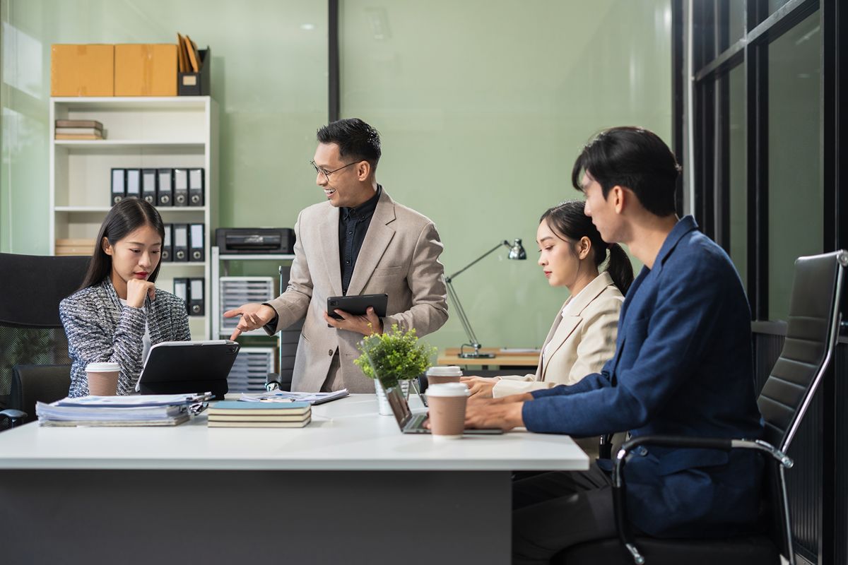 Executive team reviewing salary benchmarking data to support competitive leadership compensation