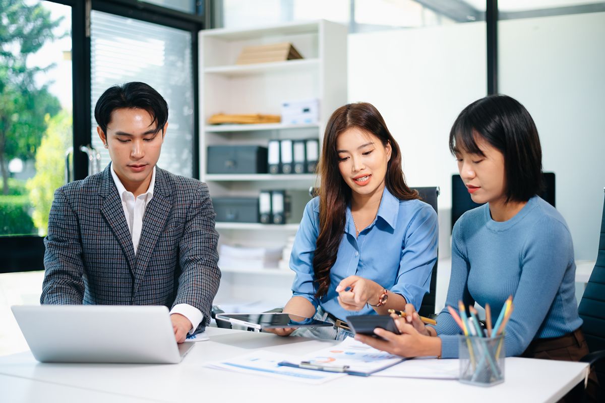 Business professionals discussing total rewards and executive compensation strategy