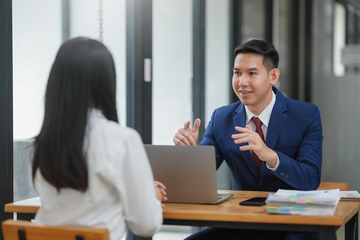 Executive candidate discussing leadership needs with a search consultant during a confidential meeting