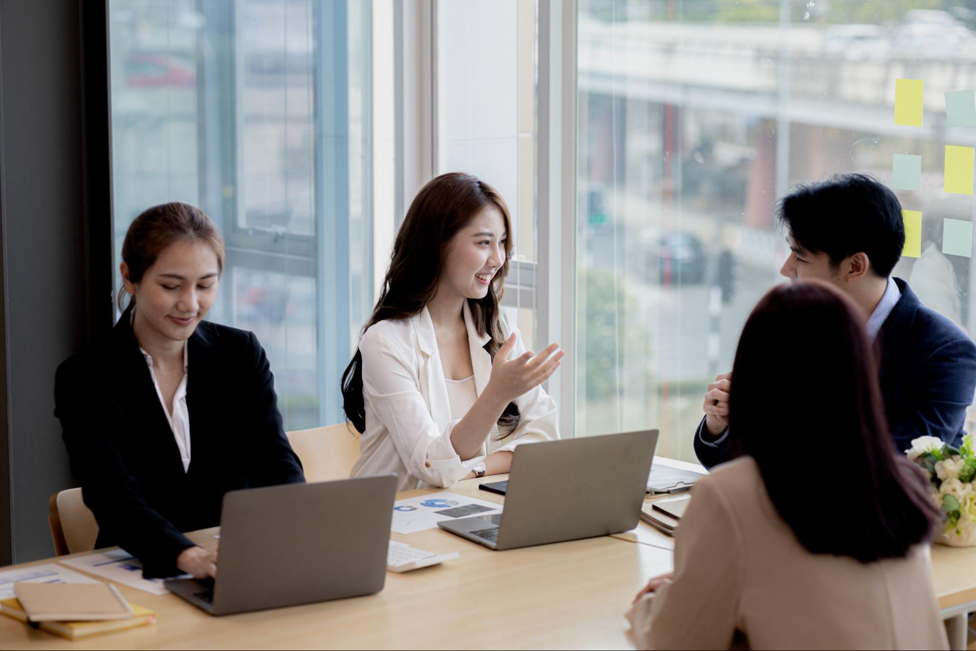 Executives discussing leadership transition planning and risk management in a private office setting