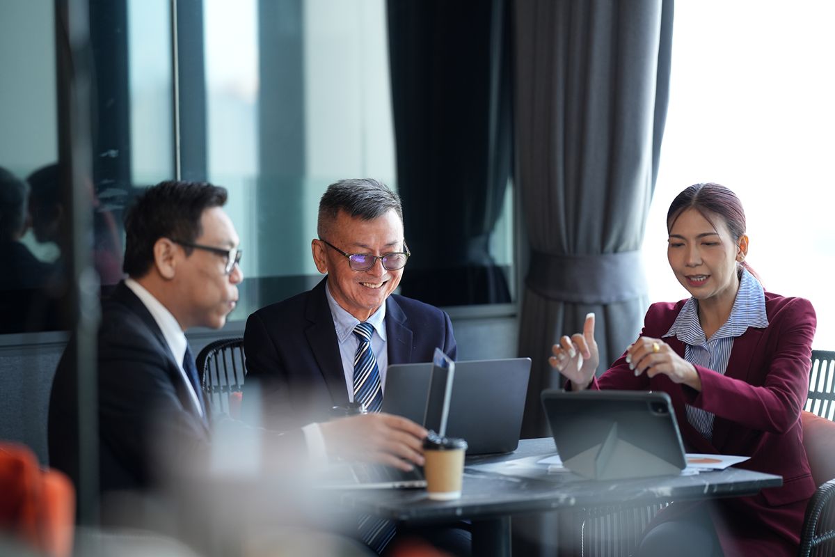Business leaders discussing market mapping and passive executive sourcing during a strategy meeting