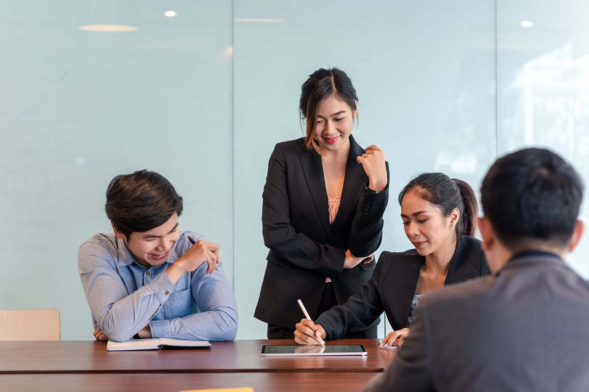 HR leaders discussing employee compensation, job satisfaction, and retention during a workplace meeting