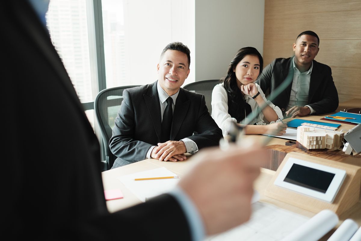 business professionals engaging in a leadership and industry discussion