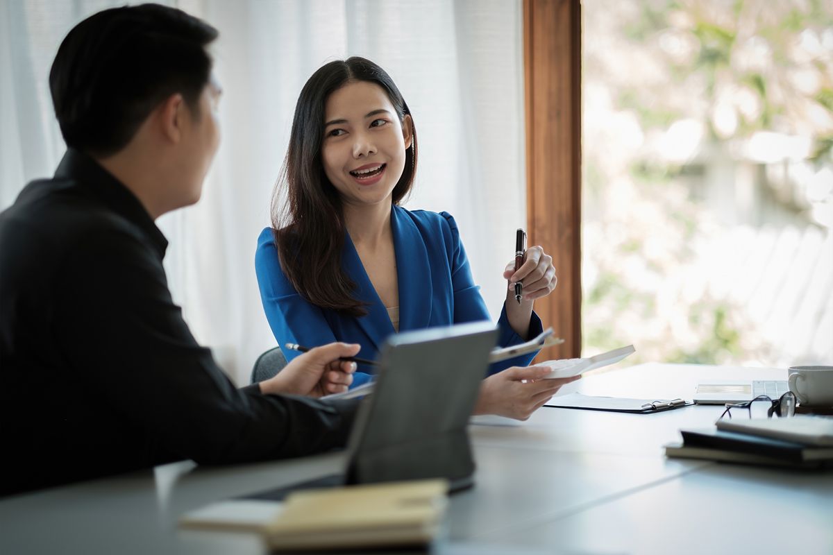 Business professionals discussing leadership adaptability and digital transformation skills during an executive recruitment interview