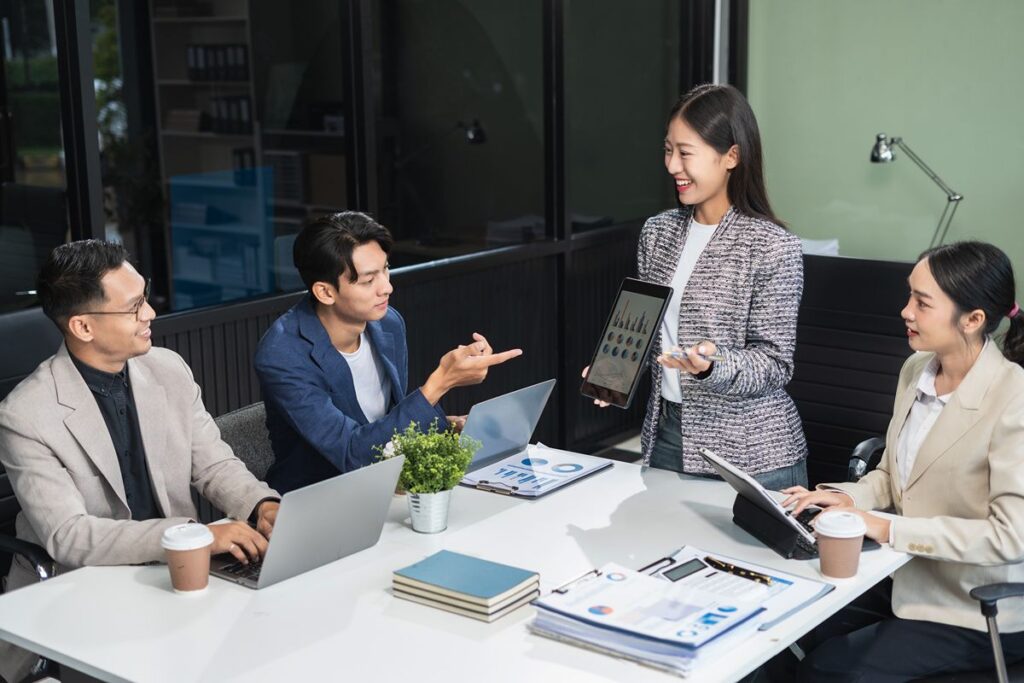 Business professionals discussing C-suite recruitment strategies and business transformation during a corporate meeting
